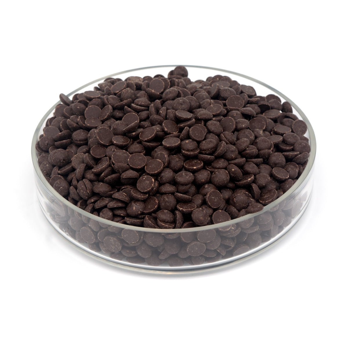 Glass bowl filled with dark chocolate chips on a white background