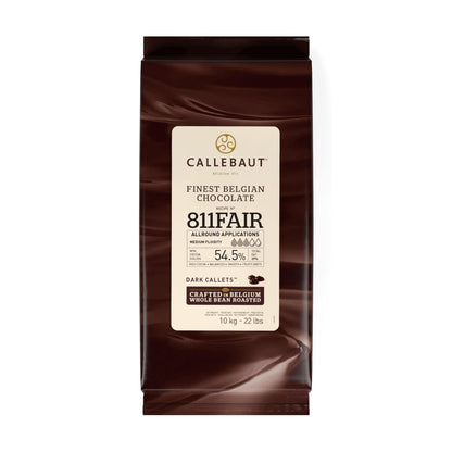 A 10 kg bag of Callebaut 811 Fair Dark Callets chocolate, featuring a cream-colored label on a dark brown background, isolated on a white studio background.