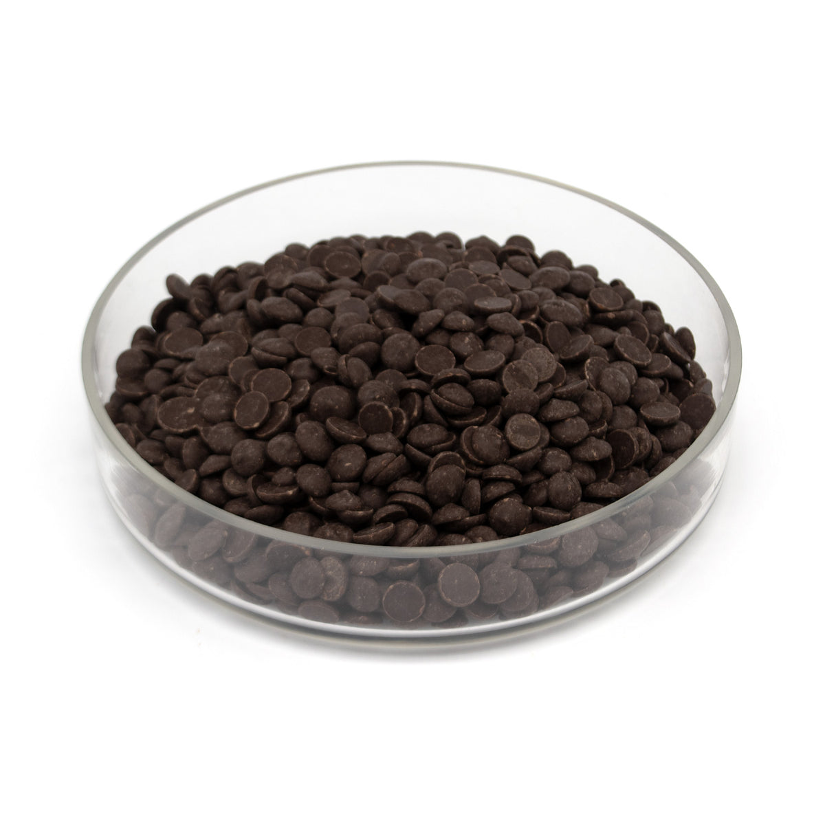Dark chocolate chips in a clear glass bowl on a white background.