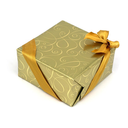 Gift box with gold ribbon and decorative paper
