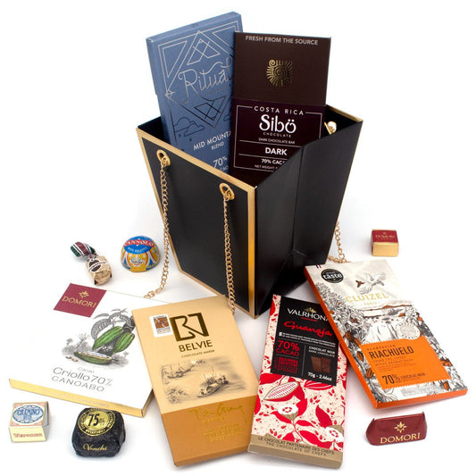 Collection of chocolate bars and packaging on a white background