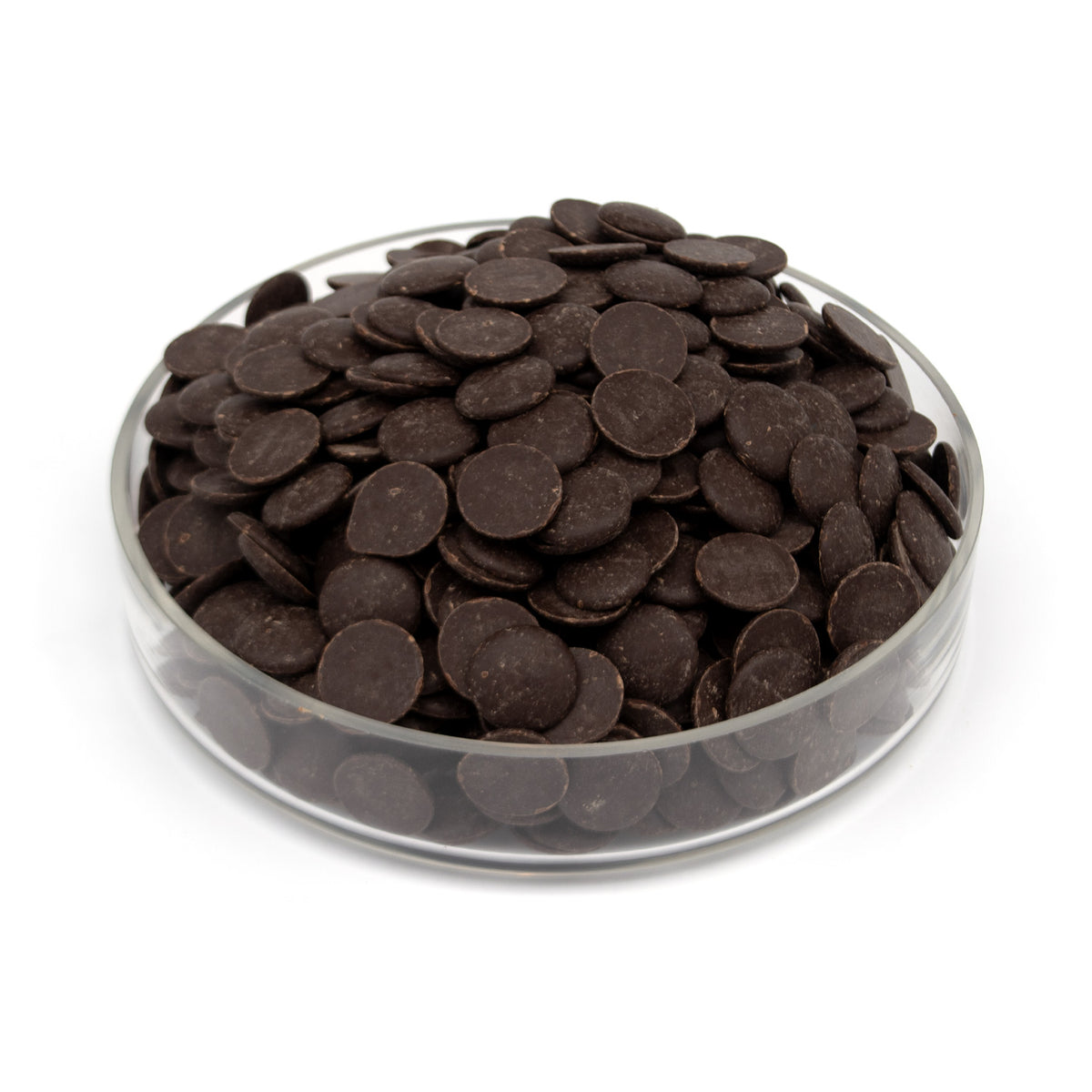 A pile of dark chocolate wafers in a clear glass bowl, photographed on a clean white background.