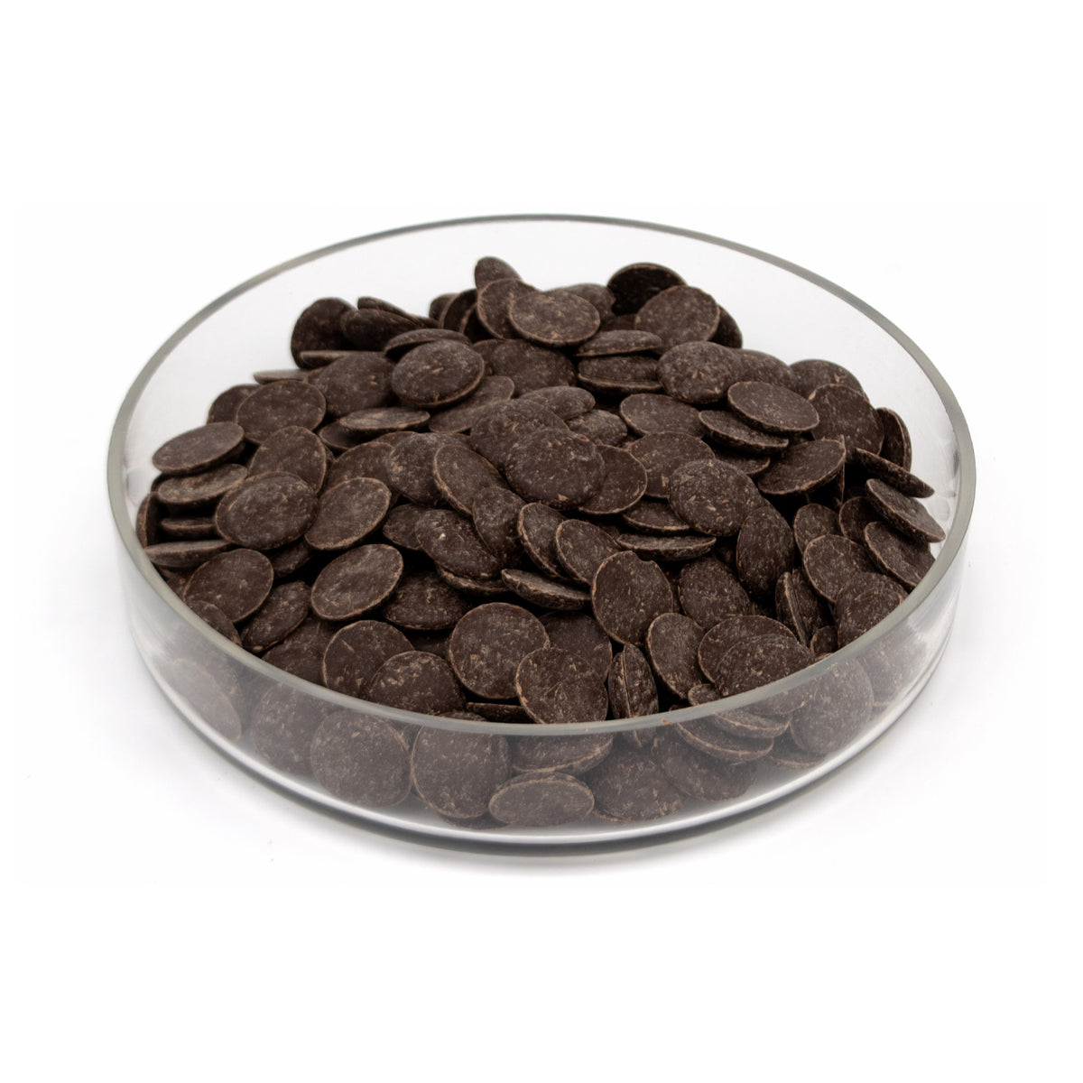 Dark chocolate wafers in a clear glass bowl, photographed on a clean white background.