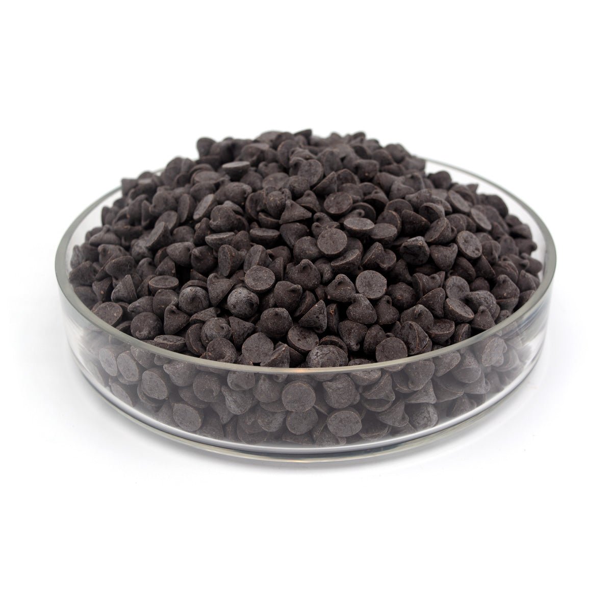 Glass bowl filled with dark chocolate chips on a white background