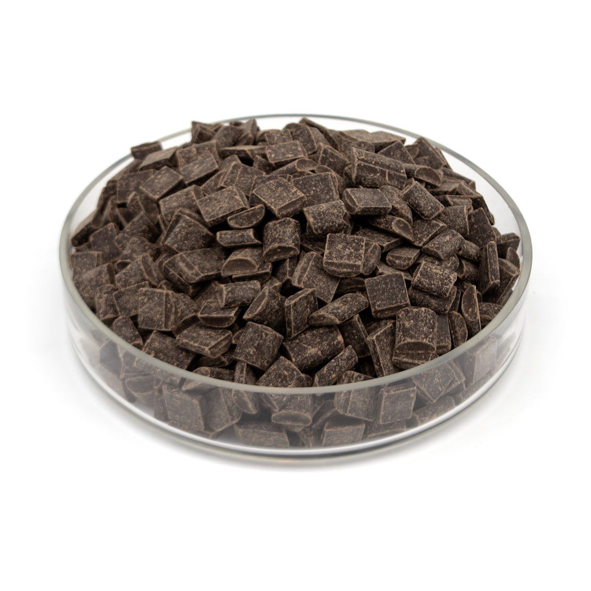 Dark chocolate chunks in a clear glass bowl on a white background.