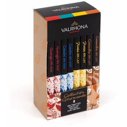 Valrhona chocolate packaging with various chocolate bars on a white background