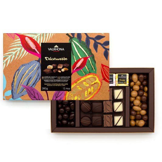 Valrhona chocolate box with colorful leaf design and various chocolates on a white background