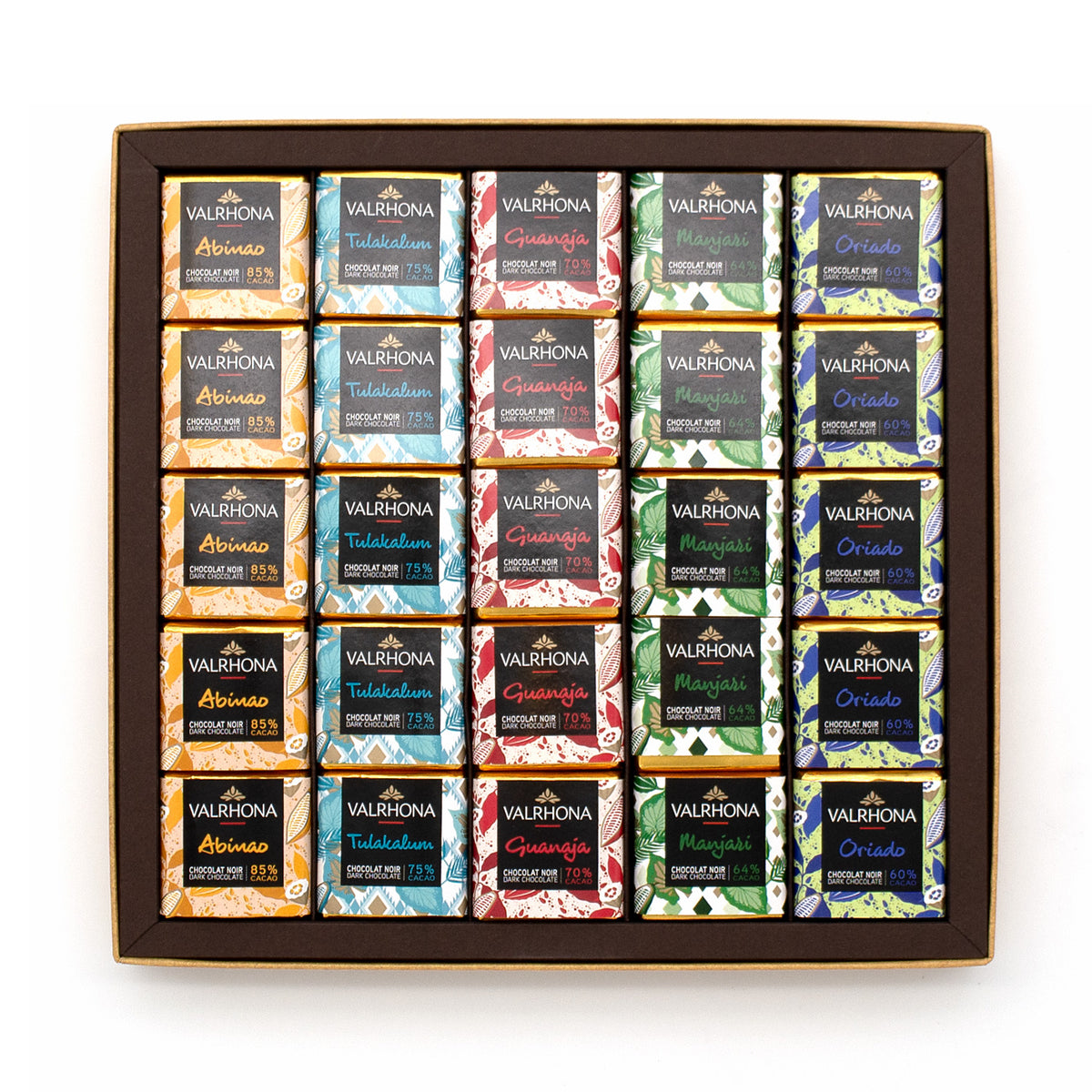 Valrhona chocolate assortment in a box on a white background.