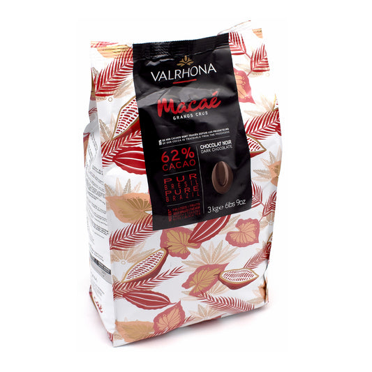 A 3 kg bag of Valrhona Macaé chocolate, featuring a white bag decorated with pink and brown botanical leaves, and a central black label.