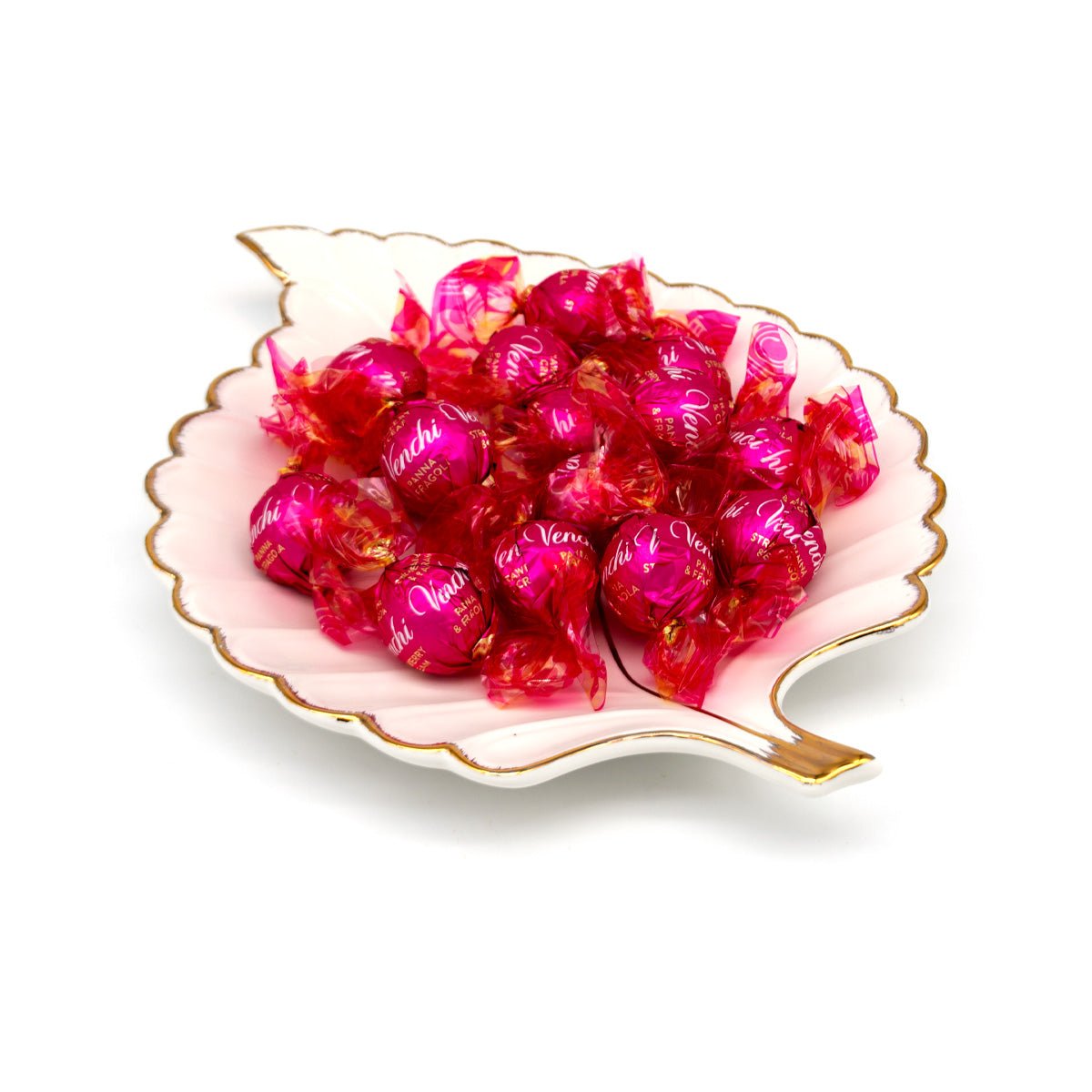 15 pink wrapped candies in a decorative dish